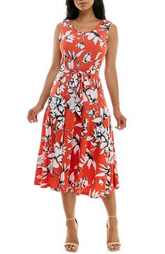 A vibrant printed midi dress is perfect for summer events. Fit: this style fits true to size. 50" length (size Medium) Crewneck Sleeveless Attached waist tie 95% polyester, 5% spandex Machine wash cold Imported Model stats: 5'10", 32" bust, 25" waist, 36" hip. Model is wearing size Medium. Sleeveless Belted Dress For Garden Party, Printed Knee-length Midi Dress For Summer, Sleeveless Midi Dress For Summer Garden Party, Summer Midi Dress With Tie Waist For Brunch, Printed Knee-length Maxi Dress For Summer, Spring Sundress With Tie Waist, Printed Summer Maxi Dress, White Summer Midi Dress With Tie Waist, White Midi Dress With Tie Waist For Summer