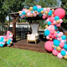 a gazebo decorated with balloons for a baby shower