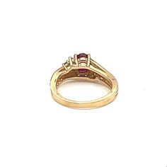 This stunning oval-shaped ring is crafted from 14k yellow gold and features a gorgeous 0.93 carat red ruby as its main stone. The ruby is accentuated by sparkling diamonds and set in an elegant design. The ring is size 5 3/4 and is made from high-quality materials. The piece is perfect for those looking for a fine jewelry piece that will make a statement. The gemstones are of exceptional quality and the design is timeless. This ring is a must-have addition to any jewelry collection. Classic Ruby Ring With Pear-shaped Stone, Gold Ruby Ring With Marquise Cut And Accent Stones, Pear-shaped Brilliant Cut Yellow Gold Ruby Ring, Classic Pear-shaped Ruby Ring, Gold Emerald-cut Ruby Ring, Gold Emerald Cut Ruby Ring, Oval Ruby Rings In Yellow Gold, Gold Ruby Ring Oval Brilliant Cut, Gold Oval Ruby Ring With Brilliant Cut