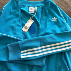 New With Tags Never Worn Perfect Condition They Do Not Sell This Style Anymore Adidas Blue Track Jacket For Streetwear, Blue Three Stripes Track Jacket For Fall, Blue Stripe Outerwear For Streetwear, Blue Streetwear Outerwear With Three Stripes, Adidas Blue Outerwear With Three Stripes, Adidas Blue Outerwear With Three Stripes Branding, Adidas Blue Track Jacket With Three Stripes, Adidas Long Sleeve Outerwear With Three Stripes, Fitted Blue Track Jacket For Streetwear