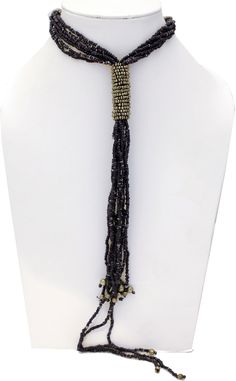 Diffused Black Beads get together in a tie around neck and come all the way down to the waist in this Black Beads Necklace with Metal Silver on the tie. The length is 28 inches, with no hooks (i.e one size), and the drop is for 12 inches. Adjustable Multi-strand Beaded Lariat Necklace, Adjustable Beaded Necklace With Large Beads For Party, Adjustable Multi-strand Party Beads, Adjustable Beaded Lariat Necklace For Parties, Beaded Long Lariat Necklace For Party, Adjustable Black Beaded Lariat Necklace, Adjustable Beaded Chain For Party, Beaded Lariat Necklace For Party, Adjustable Multi-strand Dangling Beads