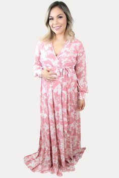 This is the perfect pink floral maternity maxi. Features a gorgeous pink color with a standout white floral print. The sweetheart neckline is perfect for nursing, long loose sleeves, and a tie waistline to keep you comfy! An ideal floral baby shower maxi, date night dress, or just because. Designed for wear throughout all nine months of pregnancy and beyond! Feminine Long Sleeve Pink Maxi Dress, Feminine Pink Long Sleeve Maxi Dress, Pink V-neck Maternity Maxi Dress, Feminine Pink V-neck Maternity Dress, Pink V-neck Maternity Dress For Maternity Wear, Pink Nursing Friendly Maternity Dress, Long Sleeve Nursing-friendly Maternity Dress For Spring, Long Sleeve Maternity Dress Nursing Friendly For Spring, Spring Long Sleeve Nursing-friendly Maternity Dress