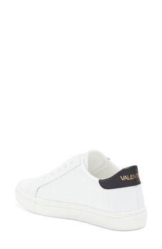 The brand's logo and a contrasting collar define a low-top sneaker shaped from smooth leather and secured with a classic lace-up closure. Leather upper/textile lining/synthetic sole Imported Sporty Low-top Sneakers With Logo Plaque, Streetwear Lace-up Sneakers With Logo Plaque, Sporty Lace-up Sneakers With Logo Plaque, White Lace-up Sneakers With Logo Plaque, Classic Lace-up Sneakers With Logo Print, Classic Lace-up Sneakers With Logo, Classic Low-top Custom Sneakers With Logo Print, Classic Lace-up High-top Sneakers With Logo, Classic Lace-up High-top Sneakers With Logo Detail