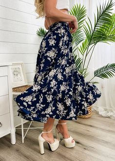 The Emes Shop skirt is detailed with vintage floral prints. Features a high waist. gartered waist. A-line silhouette. and below knee length. Pair it with a puff sleeve blouse and sandals for a classy look.MATERIAL:100% Soft Poly MEASUREMENTS:Dress Length is 31"-33"in Small | Waist: 26"-28"in Medium | Waist: 28"-30"in Large | Waist: 30"-32"in X Large | Waist: 32"-34"in MEASUREMENTS:Dress Length is 78"-83"in Small | Waist: 66"-71"cm Medium | Waist: 71"-76"cm Large | Waist: 76"-81"cm X Large | Waist: 81"-86"cm Chic Floral Print Midi Skirt, Chic Floral Print Tiered Skirt, Casual Floral Print Bottoms For Garden Party, High Waist Floral Print Skirt For Summer, Chic Flowy Maxi Skirt For Garden Party, Summer Garden Party Flowy Skirt, Chic Maxi Skirt For Garden Party, Casual Tiered Skirt For Garden Party, Spring Garden Party Long Skirt