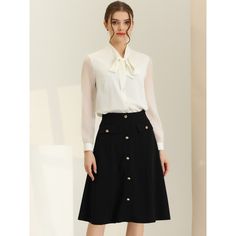 Incorporating this classic button-front skirt with an A-line cut into your wardrobe can elevate your everyday look to new heights. The charming decor button design adds a touch of elegance, making it suitable for any age and occasion. You can easily dress it up with a stylish ankle boot and a fitted knit or a fancy tie-neck shirt to add a touch of glamour to your outfit. Don't be afraid to experiment with different styles and make this versatile skirt a staple in your wardrobe. Elegant Spring Skirt With Button Closure, Spring Workwear Skirt With Buttons, Elegant Formal Skirt With Button Closure, Elegant Spring Skirt With Button Cuffs, Chic Buttoned Skirt For Workwear, Chic Formal Skirt With Button Closure, Chic Formal Skirt With Buttons, Chic Workwear Skirt With Button Closure, Chic Flared Skirt With Buttons