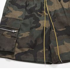 These camouflage cargo shorts allow for maximum mobility and breathability, thanks to their loose and relaxed design. With a stylish streetwear and high street pattern, this multi-pocket cargo short can help you dress to impress. Stand out in the crowd and show off your style. 60% cotton, 37% polyester, and 3% elastane Distressed Yellow drawstring closure Camouflage patten Elastic waist, drawcord, loose fit for comfort. Made from breathable, soft-washed material. Perfect for casual streetwear Si Summer Military Cargo Pants With Cargo Pockets, Military Khaki Shorts With Pockets, Military Style Khaki Cargo Shorts With Multiple Pockets, Military Cargo Shorts With Side Pockets, Military Style Cargo Shorts With Side Pockets, Military Style Cargo Pants With Cargo Pockets For Summer, Military Cargo Shorts With Multiple Pockets For Outdoor, Khaki Military Shorts For Outdoor Activities, Military Style Cargo Shorts