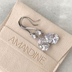 Our Iris earrings are a classic teardrop shape in a slightly longer length to perfectly frame the face. Tiny crystals are embedded into the french hook frames for additional sparkle. Length: 1 3/4", Width 1/2" Pear stones measures 14mm x 10mm 9 carat total weight Carat total weight based on diamond equivalent Custom gift box and microfiber storage pouch included Classic Pear-shaped Teardrop Earrings For Formal Occasions, Gold Teardrop Earrings With Prong Setting, Classic Formal Pear-shaped Teardrop Earrings, Classic Teardrop Pendant Earrings For Anniversary, Elegant Teardrop Pendant Earrings With French Hook, Classic Teardrop Earrings For Party, Elegant Dangle Teardrop Earrings With Prong Setting, Classic Drop Jewelry With French Hook, Classic Pear-shaped Teardrop Earrings For Party