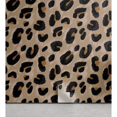 an animal print wallpaper with black and brown spots