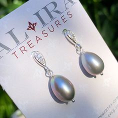 "6546 Grey Pearl Earrings Sterling Silver freshwater pearls small delicate dainty dangle drops cubic zirconia cz studs June birthstone birthday anniversary Valentine's day Mother's day Christmas holiday gift for her women mom sister wife girlfriend daughter niece aunt grandma cousin colleague best friend. Enjoy the beauty & power of natural gemstone. MATERIALS & DIMENSIONS ✦ Freshwater PEARL, grey, ovals approx. 11x9mm; ✦ STERLING SILVER pins and cubic zirconia (CZ) stud ear wires; ✦ The total l Oval Pearl Drop Earrings Gift, Elegant Drop Pearl Earrings, Delicate Pearl Earrings With Cubic Zirconia For Gift, Delicate Cubic Zirconia Pearl Earrings For Gift, Elegant Silver Pearl Earrings With Pear Shape, Elegant Pear-shaped Teardrop Earrings As Gift, Elegant Silver Pear-shaped Pearl Earrings, Oval Pearl Earrings With Pearl Charm Gift, Elegant Teardrop Earrings Gift For Her