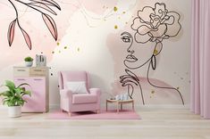 a pink chair in front of a wall mural