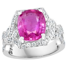 GIA CERTIFIED PINK SAPPHIRE REPORT # 2235487998 A classic, Ring Exact weight of 4.76 Ct natural Pink sapphire and 1.2 ct Round Diamond 18 Karat White gold Ring All round brilliant cut diamonds, Total diamonds 1.2 ct Natural Pink Sapphire in cushion shape , Pretty color, luster is amazing and have very little inclusions . Genuine Pink Sapphire specially of this large size are very rare and expensive . 18 Karat White Gold: 8.8 Grams Stamped for 750 Gold Ring Size 6 ( can be altered for free of cha Luxury Pink Sapphire Diamond Ring With Gemstone, Luxury Pink Sapphire Ring For Formal Occasions, Formal Pink Sapphire Diamond Ring, Luxury Pink Sapphire Ring With Brilliant Cut, Luxury Pink Sapphire Ring With Round Cut, Gia Certified Platinum Gemstones Fine Jewelry, Platinum Diamond Ring With Round Cut Gemstone, Luxury Gia Certified Pink Sapphire Diamond Ring, Round Cut Diamond Ring In Platinum