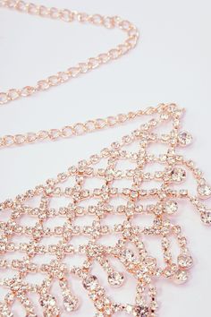 This sumptuous piece of jewelry features a retro-elegant yet slightly modern style that complements the lavish garments, reminiscent of the roaring 1920s. Features: High quality rhinestones Multi layer sparkling rhinestone tassels Height: 2.36 inch / 6 cm Length: 20 inch / 50.8 cm (extension chain included) Glamorous Rose Gold Necklaces For Party, Glamorous Rose Gold Party Necklace, Rose Gold Rhinestone Crystal Necklaces, Rose Gold Rhinestone Crystal Necklace, Rose Gold Crystal Necklaces With Rhinestones, Rose Gold Crystal Necklace With Rhinestones, Rose Gold Rhinestone Necklace For Party, Elegant Rose Gold Rhinestone Necklace For Party, Rose Gold Crystal Necklaces For Party