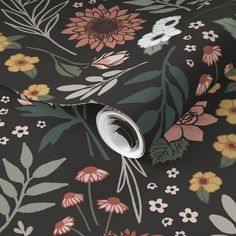 a black floral wallpaper with flowers and leaves on the back ground, it is very dark