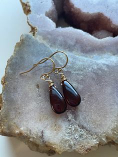 Such a unique and gorgeous stone! Bright glowly garnet hangs from gold filled or sterling silver ear wires 30mm drop Elegant Garnet Teardrop Earrings, Handmade Amber Teardrop Earrings, Nickel-free Yellow Gold Teardrop Jewelry, Garnet Drop Earrings As Gift, Dainty Nickel-free Teardrop Jewelry, Teardrop Pendant Jewelry With Matching Earrings For Gift, Garnet Drop Earrings With Ear Wire, Garnet Drop Earrings For Gifts, 14k Gold Filled Teardrop Earrings For Gift