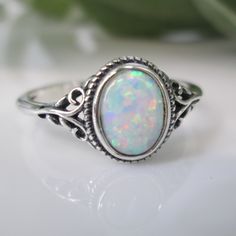 Dainty Opal Ring. Best Seller. For Your Consideration Is This Oh So Pretty 925 Sterling Silver And Opal Ring. Simple, Comfortable, And Beautifully Crafted. Face Height On This = 10mm. An Oval Fiery White Lab Opal Is The Star. A Little Oxidized Detailing Is A Great Accent To This Lovely Oval Opal Stone. Ref:Sid-F26 Opal And Silver Ring, Opal Engagement Ring Silver Simple, Adjustable Oval Cabochon Opal Ring, Fine Jewelry Sterling Silver Oval Opal Ring, Dainty Oval Sterling Silver Stackable Rings, White Oval Cabochon Promise Ring, White Opal Ring Stamped 925, Oval Sterling Silver Stackable Rings, White Oval Adjustable Rings