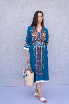 "This beautiful bohemian embroidered tunic dress is surely going to add life and oriental charm to your closet. The dress is made of Egyptian cotton which is widely renowned for its quality and texture. The dress is light and extremely soft and can be used on many occasions - beach, lounge, or even in your home to feel comfortable. Fabric : 70% Egyptian Cotton; 30% Polyester. Tunic measurements in inches : Small (Size 4/6 USA) Bust : 36-37 Hip : 40-41 Medium (Size 8/10 USA) Bust : 39-40 Hip : 45 Traditional Maxi Length Embroidered Dress, Spring Folk Style Kaftan With Geometric Embroidery, Traditional Embroidered Maxi Dress With Embroidered Neckline, Traditional V-neck Boho Dress For Spring, Traditional Maxi Dress With Embroidered Neckline, Traditional Tunic Dress With Multicolor Embroidery, Festive Tunic Dress With Multicolor Embroidery, Spring Folk Style Embroidered Kaftan, Traditional V-neck Dress With Embroidered Neckline