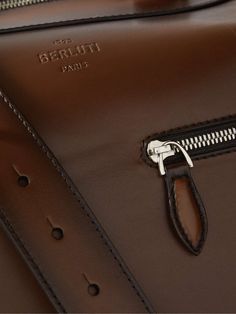 BERLUTI Venezia Leather Holdall Bag for Men | MR PORTER Luxury Saddle Bag Satchel With Top Carry Handle, Luxury Cognac Shoulder Bag With Top Carry Handle, Luxury Cognac Shoulder Bag With Top Handle, Luxury Cognac Saddle Bag For Daily Use, Luxury Brown Saddle Bag With Detachable Strap, Brown Luxury Saddle Bag With Detachable Strap, Luxury Brown Saddle Bag, High-end Brown Satchel Briefcase, Luxury Cognac Saddle Satchel Bag