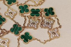 Indulge in the opulent elegance of our CLOVER 20 MOTIFS MALACHITE DIAMOND GOLD NECKLACE. Crafted with 20 stunning motifs adorned with malachite and diamonds, this necklace exudes luxury and sophistication. Elevate any outfit with this exclusive piece that embodies the beauty of art and fashion. ADDITIONAL INFORMATION Color: Gold Stone: Malachite, Cubic Zirconia Ref. vcarp34806 Material:- 925 Sterling Silver - 18k Gold Plated- 18k Real Gold ( contact us via instagram) Length of chain : 84cm Our r Luxury Jeweled Necklaces For Anniversary, Luxury Green Jewelry With Polished Finish, Luxury Yellow Gold Jewelry, Luxury Pendant Necklace, Luxury White Gold Necklace, High Quality Gold Jewelry As A Gift, Designer Gold Necklaces For Anniversary, Luxury Wedding Necklaces, Elegant Green Gold Plated Necklace