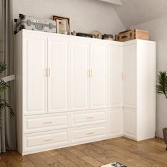 a living room filled with furniture next to a tall white wall mounted cabinet and potted plant