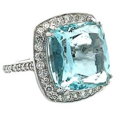 Our cushion ring will undoubtedly captivate your heart with its stunning aquamarine gemstone that glimmers with every movement. The centerpiece of this magnificent ring features a remarkable 15.50-carat aquamarine that is elegantly surrounded by 1.65 carats of dazzling round white diamonds. It makes this ring with 17.15 total carat weight. This ring is crafted from 18K white gold, adding a touch of luxury and sophistication to this impressive piece. With a finger size 7, this fashionable ring is Diamond Ring Set, Rings Fashion, Aquamarine Jewelry, Diamond Ring Settings, Fabulous Jewelry, Bling Rings, I Love Jewelry, Fine Rings, Gorgeous Jewelry