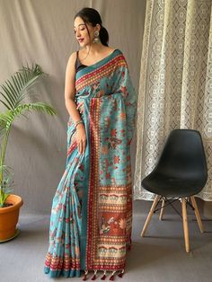 Delightfully produced from pure malai cotton, this sky-blue saree with a classic contrast blouse is a must-have addition to your ethnic wear collection. The vibrant kalamkari prints on the saree add a touch of excitement and uniqueness, making it stand out from the crowd.
The intricate detailing of the print, combined with the serene sky-blue hue, gives this saree a timeless aesthetic appeal. It exudes elegance and sophistication, perfect for any occasion. The ensemble is reminiscent of clear su Kalamkari Prints, Tassels Blouse, Royal Blue Saree, Sky Blue Saree, Kalamkari Print, Kalamkari Designs, Kalamkari Blouse, Kantha Sarees, Brocade Saree