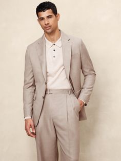 This timeless suit jacket is cut from an Italian wool fabric we love for its subtle twill texture.  Designed to carry you through all seasons, this beautiful fabric is woven in a Super 120's weight—the perfect balance of fine handfeel, beautiful drape, and everyday durability.  Wrinkle-Resistant, Breathable, Stretch Tailored Slim Fit: More relaxed than our Slim Fit, this Italian cut style has a softer shoulder construction.  Fabric from Italy's Lanificio Guabello.  Notch lapel with 2-button front.  Three exterior pockets, three interior pockets.  Single back vent.  Fully lined.  Tailored Slim Fit: More relaxed than our Slim Fit, this Italian cut style has a softer shoulder construction.  Long sleeves.  Below-hip length.  Model: Size 42, 6'2" (188cm). Light Suit, Semi Formal Attire, Boys Closet, Blazer Designs, Suits And Jackets, Mens Khakis, Khaki Color, Men's Wardrobe, Wool Fabric