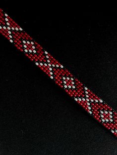 Necklace of red  colour with pattern (red and black colors) 100% Handmade  quality beads Bead length - 28cm/11.02in + chain Wedth - 1.4cm/0.55in The necklace has ties with which it will fit beautifully on any neck. If you need to change the length of the necklace - write a message. I will adjust the length to your size for free! How to care for your jewelry🌸 To ensure that your jewelry will serve you for a long time, here are some recommendations for its care😉: - do not wash in water💦 - keep away from sunlight🌞 - it is not advisable to apply products that contain active chemical components🫧 do not drop or hit the jewelry, because beads are fragile material🤍✨  Make your order with inspiration, SolNeck Traditional Red Beads Choker, Red Handwoven Beaded Necklace For Festivals, Handwoven Red Beaded Necklace For Festivals, Handmade Red Beaded Choker Necklace, Gift Red Handwoven Beaded Necklaces, Artisan Red Spacer Beads, Artisan Red Beaded Bracelets For Festivals, Red Handwoven Necklaces With Round Beads, Red Bohemian Beaded Necklace For Gift