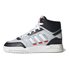 the adidas basketball shoe is black and white with red accents on the upper part