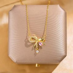 New Beautiful!! Stainless Steel Gold Tone Bow Know Pendant With Cz's Necklace. Necklace Has An Extension On The Clasp. Perfect For Yourself Or As A Gift. Very Unique And Different. Very Shiny And Brilliant!! Suitable For All Occasions. Suitable For Most Ages. Nwt Pink Cubic Zirconia Necklace For Party, Pink Diamond Necklaces For Gifts, Pink Cubic Zirconia Rhinestone Necklace As Gift, Elegant Pink Rhinestone Necklace For Gift, Elegant Pink Rhinestone Necklace For Party, Elegant Pink Cubic Zirconia Necklaces, Elegant Pink Necklaces With Rhinestones, Rose Gold Rhinestone Necklace For Gift, Elegant Pink Cubic Zirconia Necklace