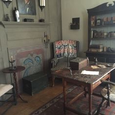 a living room filled with furniture and a fire place