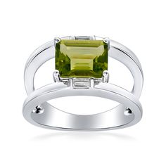 Ross-Simons - 2.30ct Peridot Open-Space Ring, White Topaz Accents in Silver. Size 6. Experience captivating gemstone color in a modern design. Our sleek ring features a stunning 2.30 carat emerald-cut peridot amid ample open space. Sparked at the top and bottom by baguette white topaz accents and set in mirror-bright sterling silver. 3/8" wide. Peridot open-space ring. Peridot birthstones are the perfect gift for August birthdays. Peridot Silver Ring, Silver Peridot Rings In Fine Jewelry Style, Silver Peridot Birthstone Ring With Accent Stones, Silver Peridot Ring For Formal Occasions, Silver Peridot Ring With Birthstone, Silver Peridot Rings With Polished Finish, Space Rings, August Birthstone Ring, Peridot Birthstone