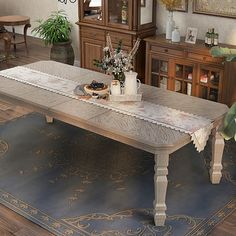 a dining room table with flowers on it