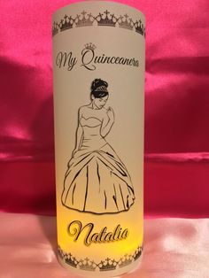 a wine bottle with a drawing of a woman in a ball gown on it's side