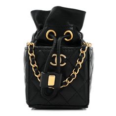 This is an authentic CHANEL Calfskin Quilted Mini Drawstring Bucket Bag in Black. This chic shoulder bag is crafted of luxurious diamond-quilted calfskin in black. The bag features a leather-threaded gold chain shoulder strap and a flap with a matching gold classic CC turn lock. The flap opens to a black leather and fabric interior. 1398289 High-end Black Quilted Bag, Luxury Quilted Shoulder Bag For Evening, High-end Quilted Bags For Formal Occasions, High-end Quilted Formal Bag, High-end Formal Quilted Bags, Luxury Rectangular Shoulder Bag With Diamond Quilting, Evening Leather Shoulder Bag With Diamond Quilting, Leather Evening Shoulder Bag With Diamond Quilting, Leather Shoulder Bag With Diamond Quilting For Evening