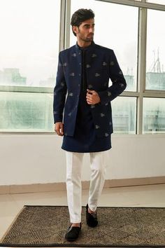 Navy blue bandhgala with all over embroidery. Comes with inner kurta and pant.
Components:3
Embroidery
Neckline:Mandarin collar
Sleeve Length:Full
Fabric:Viscose Polyester
Color:Blue
Embroidered kurta placket
Welt pocket
Side slits
Button front closure - Aza Fashions Men’s Koti Kurta, Tilak Dress For Men, Men’s Bandhgala, Indowestern Kurta For Men, Bandgala Suit For Men, Kurta For Wedding For Men, Bandgala Suits For Men, Indian Suits For Men, Summer Wedding Outfits Indian Men