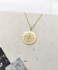 WE SHIP ALL PARCELS IN ONE BUSINESS DAY FOR FREE AND PROVIDE THE SPEEDIEST DELIVERY! Engraved Compass Design Necklace - Compass Pendant Necklace - Handmade Compass Gold Jewelry - Engraved Compass Gold Necklace Engraved Compass Pendant Necklace made out of 14K Solid Gold. Available only in Yellow Gold finish. An elegant piece of jewelry that is a perfect gift to yourself and your loved ones. Charm Thickness: 0.5mm Jump Ring inner diameter: 4mm Add your engraved personalization at the back of the Gold Etched Jewelry For Commemoration, Etched Yellow Gold Jewelry For Commemoration, Gold Necklace With Compass Design For Anniversary, Gold Anniversary Necklace With Compass Design, Anniversary Gold Necklace With Compass Design, Personalized Gold Jewelry For Travel, Personalized Gold Necklace For Travel, Gold Engraved Jewelry For Travel, Gold Medallion Jewelry For Travel