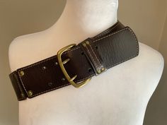 "Vintage Banana Republic wide dark brown leather belt featuring 3 sections with antiqued brass double studs linking the panels.  Antique brass buckle with double prongs and the brass studded leather retainer ..Stitching details accent each panel and retainer... chic streetwear style - jeans, accent a suit or a casual dress. Great Vintage condition ...Original attached tag $79.00 Material: Dark Brown Leather....antiqued brass hardware. Brand Label: Banana Republic Measurements: Buckle 2 7/8\"  x Luxury Brown Rustic Belt, Brown Leather Belt With Brass Hardware, Brown Belt With Brass Hardware For Everyday, Vintage Leather Belt Buckles With Rivets, Vintage Brown Belt With Rivets, Vintage Brown Belts With Rivets, Adjustable Brown Belt With Rivets, Thrift Clothes, Stud Belt