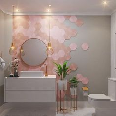 a modern bathroom with pink hexagonal tiles on the wall