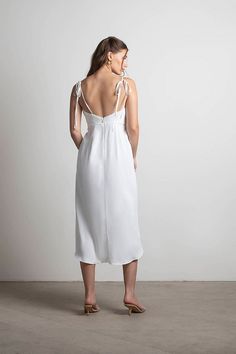 Cherish This Moment Wrap Midi Dress in Ivory - $64 | Tobi US Straight Neckline Dress With Tie Back For Date Night, White Suspender Dress With Tie Straps For Brunch, Chic White Suspender Dress For Brunch, Chic Slip Dress With Tie Back And Fitted Bodice, White Suspender Dress With Spaghetti Straps For Casual Wear, Fitted Suspender Dress With Tie Straps For Brunch, Chic White Dresses With Adjustable Straps, White Suspender Dress For Date Night, White Bridesmaid Dress With Bow Straps