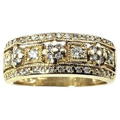 14 Karat Yellow Gold and Diamond Band Ring Size 7- This sparkling band features 48 round brilliant cut diamonds set in beautifully detailed 14K yellow gold. Width: 7 mm. Inner inscription reads: "8-5-06". Approximate total diamond weight: .40 ct. Diamond color: H-I Diamond clarity: SI1-I1 Ring Size: 7 Weight: 3.8 dwt. / 5.7 gr. Hallmark: 14K Very good condition, professionally polished. Will come packaged in a gift box or pouch (when possible) and will be shipped U.S. Priority Mail Insured. DV08 Yellow Gold Diamond Ring With Decorative Band, Yellow Gold Diamond Jewelry With Decorative Band, Yellow Gold Diamond Band With Decorations, Gold Diamond Band With Single Cut Diamonds, Heirloom Diamond Ring With Wide Band, Fine Jewelry Diamond Ring With Decorative Band, Yellow Gold Diamond Wedding Ring With Decorative Band, Yellow Gold Diamond Wedding Band With Decorative Detail, Heirloom Diamond Bands In Yellow Gold