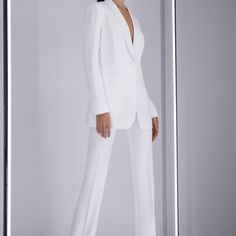 Spring Tuxedo Pantsuit With Notch Lapel, Spring Tuxedo Pantsuit With Lapel Collar, Chic Evening Pantsuit With Single Breasted Detail, Chic Tailored Pantsuit With Lapel Collar, Spring Tuxedo Style Tailored Pantsuit, Chic Semi-formal Pantsuit With Notch Lapel, Spring Semi-formal Structured Pantsuit, Chic Formal Pantsuit With Hidden Button Closure, Tailored Tuxedo Style Pantsuit For Spring