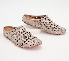 A geometric cutout design gives these leather mules a light and airy feel with breathable comfort for your feet. From Spring Step. Spring Slip-on Flats With Perforations, Summer Leather Slip-ons With Perforations, Leather Slip-ons With Perforations For Summer, Spring Perforated Flat Heel Slip-ons, Spring Slip-ons With Perforations And Flat Heel, Spring Flat Slip-ons With Perforations, Slip-on Perforated Sandals For Spring, Perforated Slip-on Sandals For Spring, Spring Slip-on Sandals With Perforations