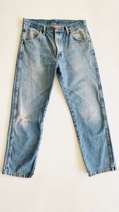 Natural waist, 4 pocket, non stretch jeans. Great vintage wear and fading. 100% cotton.  Waist: 16.5" Hips: 21" Rise: 11" Inseam: 29" Hem: 8" Light Wash Pre-washed Cotton Jeans, Classic Washed Blue Cropped Denim Jeans, Classic Washed Blue Cropped Jeans, Pre-washed Recycled Denim Blue Jeans, Fitted Pre-washed Blue Jeans, Faded Recycled Denim Cropped Jeans With Five Pockets, Pre-washed Straight Leg Denim Blue Jeans, Distressed Medium Wash Rigid Denim Jeans, Faded Cropped Jeans With Five Pockets