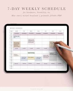 the 7 - day weekly schedule is displayed on a tablet with a person's hand writing