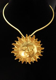 For the person who wants a little magic in their life, this large and fabulous large golden sun  pendant on this unusual shaped beautiful golden choker will bring in the compliments ! The gold plate is brilliant like Egyptian gold. See photos for more views and size.  3-4-21