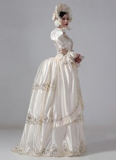 19th Century Champagne Victorian Bustle Dress Gown  Color:Champagne  Material: This dress made of High Quality Satin, soft,smooth and comfortable to wear  Sleeve Length:  Long Sleeve  Dresses Length:Floor Length  Neckline:  Square Collar  Decoration: Ruffles + Lace  Package Includes:  Dress + Hat    The length of skirt about 45 inches (114 cm) long from waist to hem regardless of size. This dress is pictured with a 6-hoop skirt Petticoat underneath to achieve the look. Petticoat are NOT INC Cream Satin Dress For Banquet, Victorian Fitted Dress For Debutante Ball, Beige Fitted Dress For Costume, White Satin Full Length Dress, Cream Satin Floor-length Gown, Elegant Beige Costume Dress, Regency Style White Victorian Dress For Debutante Ball, White Regency Victorian Dress For Debutante Ball, White Regency Style Victorian Dress For Debutante Ball