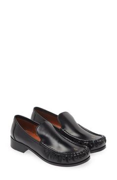 "Find ACNE STUDIOS Babi Moc Toe Loafer on Editorialist. A goldtone logo letter at the moc-stitched toe brings understated branding to this suave loafer crafted of burnished calfskin leather 1\" heel (size 39) Leather upper, lining and sole Made in Italy Designer Shoes" Timeless Loafers With Branded Insole And Moc Toe, Calf Leather Slip-on Loafers For Business Casual, Business Casual Calf Leather Slip-on Loafers, Office Moc Toe Slip-ons With Leather Footbed, Office Slip-ons With Leather Footbed And Moc Toe, Formal Platform Loafers With Textured Sole And Plain Toe, Formal Platform Loafers With Textured Sole, Formal Moccasins With Stitched Sole And Round Toe, Elegant Tassel Loafers With Textured Sole And Moc Toe