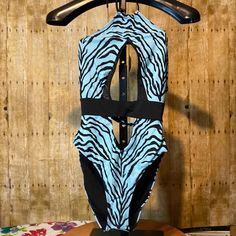 Sexy One Piece Swimsuit By Icon Swim. New Never Worn. Great For A Summer At The Beach. Has Stretch To It. Size Xl. See Photos For Measurements. Smoke And Pet Free Home. One-piece Swimwear For Club And Beach Season, Trendy Black Swimwear For The Beach, Trendy Black Swimwear For Beach, Fitted Zebra Print Swimwear For Summer, Trendy Cutout Stretch Swimwear, Black Fitted Swimwear With Zebra Print, Black Swimwear For Beach Season And Club, Black Swimwear For Club During Beach Season, Fitted Black Zebra Print Swimwear