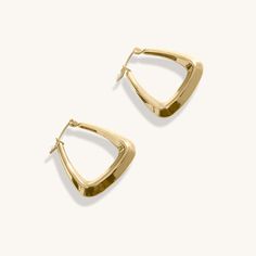 The 18K Gold Plated Gracie Hoop Earrings. A brand new addition that's already proving to be a timeless classic here at Midas. A beautifully sculpted shape, inspired by trips to Morocco. These really compliment every outfit and frames every face perfectly, why not face the day with these by your side? When you're not wearing this piece, tuck it away in your very own Milou jewellery box provided. Stainless Steel, plated with 18K Gold Waterproof (Tarnish Resistant) Natural Linen Milou Jewellery Box Formal Brass Hoop Earrings, Small Brass Hoop Earrings For Formal Occasions, Modern Gold-tone Pierced Hoop Earrings, Chic Brass Hoop Earrings For Formal Occasions, Chic Polished Finish Hoop Earrings As Gift, Timeless Brass Hoop Earrings, Chic Polished Finish Hoop Earrings For Gift, Chic Polished Hoop Earrings As Gift, Timeless Small Hoop Earrings For Everyday