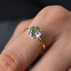 D E T A I L S - Material: 925 Sterling SilverStone: Blue Topaz Stone Shape:- Round Stone Size:- 8mmThe Fit: True to US ring size Finish: Smooth and Gold PlatedS H I P P I N G & P R O D U C T I O N - My current production time is 2-6 business days, which means after those days are up, your order ships! I make everything custom to order, by hand, but I promise you it's worth the wait!R U S H - M Y - O R D E R -If you're in a rush to get your pretty new pieces, please send me a message and I'll Sapphire Topaz Round Ring For Promise, Sapphire Topaz Promise Ring, Gold Blue Topaz Ring For Promise, Sapphire Topaz Ring For Promise, Dainty Round Cut Topaz Promise Ring, Round Topaz Ring For Gift, Gold Blue Topaz Promise Ring, Promise Ring With Blue Topaz, Topaz Birthstone Ring With Round Cut